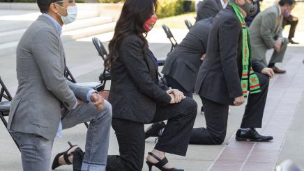 Closeup of Assemblymember Rubio kneeling outside the state capitol in a tribute to George Floyd