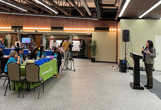 Assemblywoman Rubio speaking in front of group at the career and resource fair