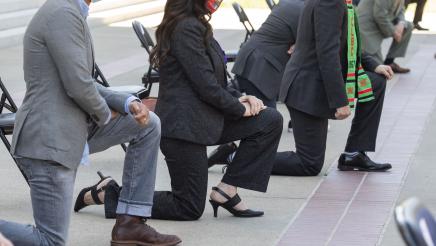 Closeup of Assemblymember Rubio kneeling outside the state capitol in a tribute to George Floyd