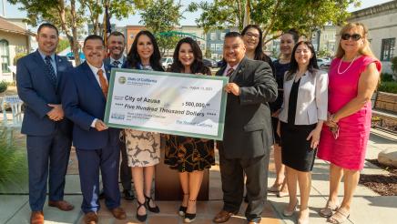 State and Local officials hold big check